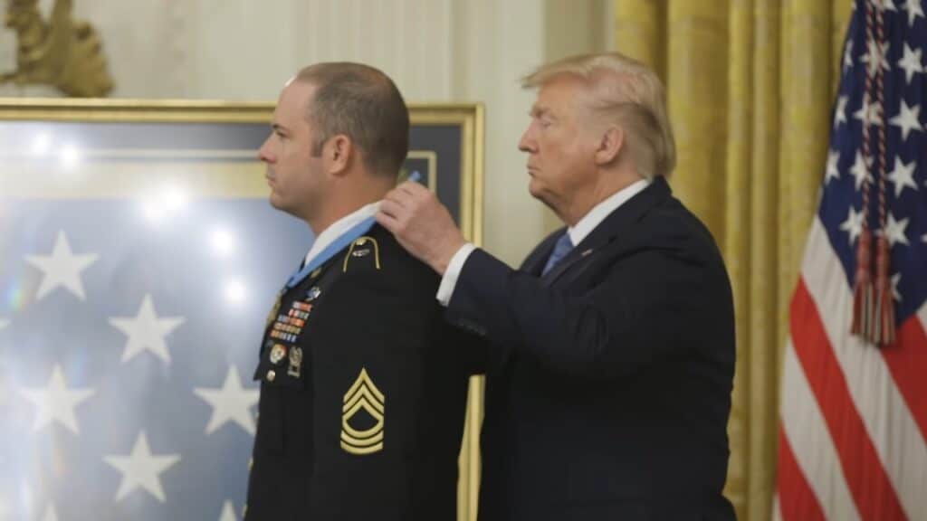 A picture of a Medal of Honor recipient receiving the award from Donald Trump, the President of the United States
