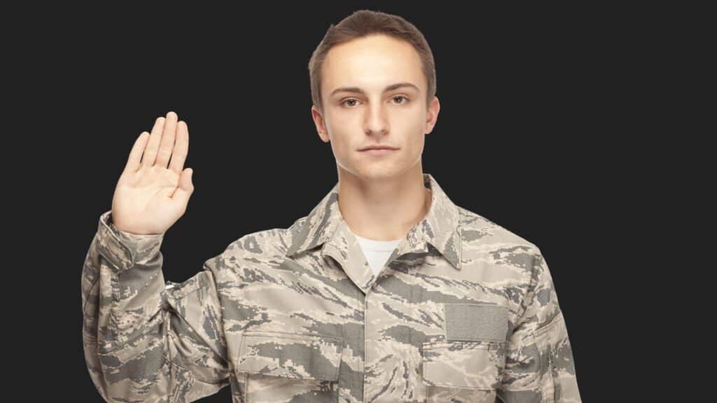 An airman in uniform taking the enlistment oath