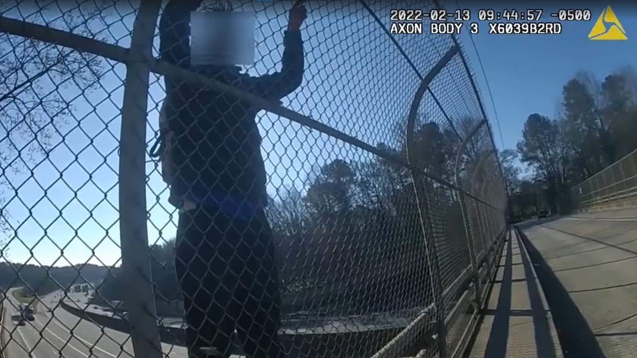 Atlanta cop talks distressed man down from bridge